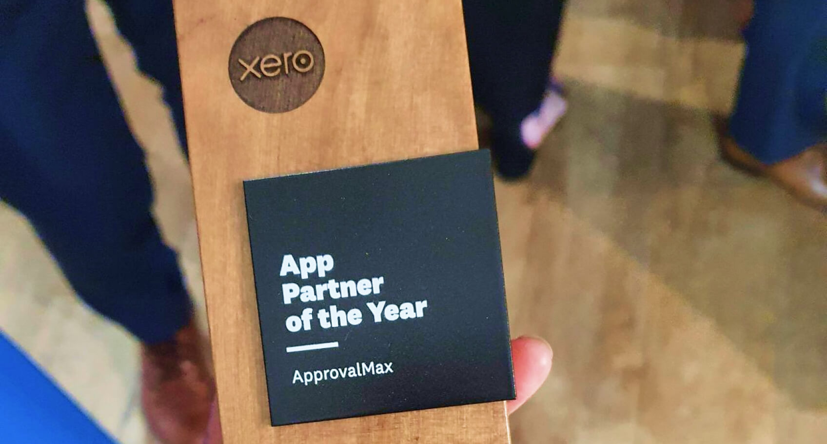Xero's App Partner of the Year wooden trophy held in a person's hand